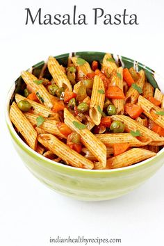 a bowl filled with pasta and vegetables on top of a white table next to the words masala pasta