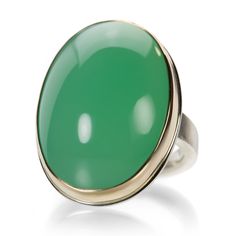 Deliciously delightful, this Jamie Joseph ring features a smooth oval chrysoprase cabochon. The sleek design is finished with a 14k yellow gold bezel and sterling silver X band. This ring is so lively that if you choose the occasion, it will be there! Stone measures about 7/8" x 1 1/8" including the bezel. Size 7.25. Handcrafted in Seattle, WA, U.S. Classic Oval Chrysoprase Ring, Yellow Gold Emerald Chrysoprase Cabochon Ring, Elegant Green Opal Ring With Oval Cabochon, Elegant Green Opal Ring Oval Cabochon, Elegant Oval Chrysoprase Rings, Classic Green Oval Opal Ring, Classic Green Opal Cabochon Ring, Green Oval Opal Ring With Polished Finish, Modern Oval Jade Ring