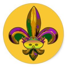 a yellow button with a purple and green fleur de lis design on it