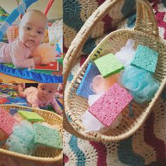 a baby laying on top of a blanket next to a basket filled with soap bars