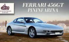 a silver sports car parked in front of a sign that says ferrari 450gt pinnerina