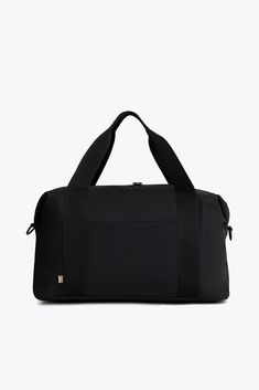 Introducing the new BEISICS Duffle in Black, a sleek and modern design with plenty of space for all your travel essentials. From everyday to the weekend this duffle bag will take you from the airport to your destination with ease. Rectangular Functional Duffle Bag For Weekend, Versatile Black Gym Bag For Overnight Trips, Functional Weekend Duffle Bag, Modern Black Weekender Bag For Overnight Trips, Versatile Black Duffle Bag With Luggage Sleeve, Modern Black Gym Bag For Overnight Trips, Black Large Capacity Duffle Bag For Weekend, Large Capacity Black Duffle Bag For Weekend, Weekend Black Large Capacity Duffle Bag