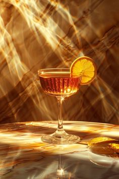 a glass filled with liquid sitting on top of a table