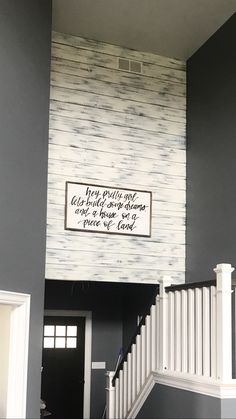 the stairs are painted gray and white with a sign above it that reads, you can't wait for someone to come home