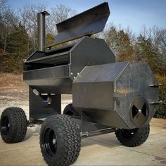 a large metal object sitting on top of a parking lot