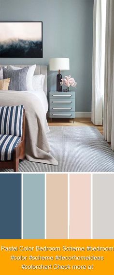 a bedroom with blue walls, white bedding and striped pillows in shades of gray