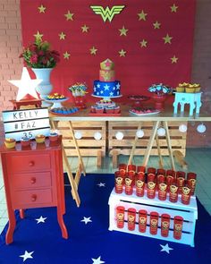 the dessert table is set up with red, white and blue items for wonder's birthday