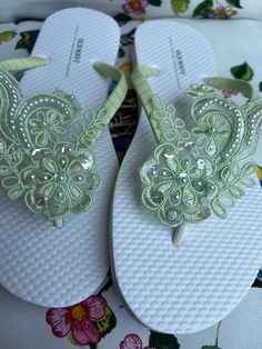 These beautiful flip flops are wrapped with a green matte ribbon, and adorned with a beaded green appliqué with pearls and sequins. Ribbon color is green you are needing other colors of ribbon or decoration please contact me and will be happy to accommodate you!  Flip Flops can be made for child and adult size. All flip flops are handmade to order and the production time is 1 to 2 weeks business days and then please allow time for shipping. Amazing for beach, weddings, flower girl or a fancy eve Elegant Embellished Green Sandals, Elegant Green Embellished Sandals, Spring Wedding Beaded Sandals, Beaded Flip Flops For Summer Party, Summer Party Beaded Flip Flops, Adjustable Embellished Flip Flops For Summer, Party Beaded Open Toe Flip Flops, Embellished Wedding Sandals For Summer, Party Beaded Flip Flops