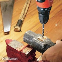 a person using a drill to cut wood with a hammer and an angle grinder