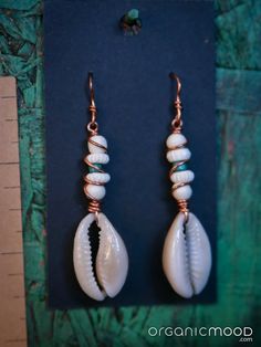 Indigenous cultures and the natural world inspire the handmade jewelry of Organic Mood Earthen Accessories. The work featured creatively emulates nature, incorporates portions of nature, and/or protects nature by utilizing repurposed and found materials. Seashell Jewelry, Indigenous Culture, Cowrie Shell, Shell Earrings, The Natural World, Natural World, Jewelry Earrings Dangle, Etsy Earrings, Dangle Drop Earrings