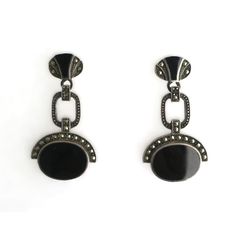 This is part of Chairish’s Fine Jewelry assortment.  A beautiful pair of black onyx and sterling silver Art Deco style dangle earrings, circa mid to late-20th century. A great pair to dress up or down. Each are marked on back 'Sterling' as shown in last three images. Excellent condition as shown in images. No issues. Dimensions: 1.5" Long. Deco Earrings, Art Deco Earrings, Silver Art, Art Deco Style, Deco Style, Black Onyx, Art Deco Fashion, 20th Century, Onyx