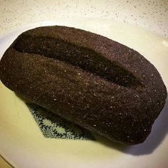 a piece of bread sitting on top of a white plate