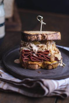 a sandwich with meat and cheese on a plate