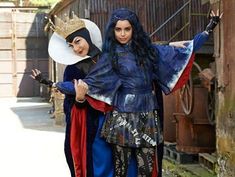 two women dressed in medieval costumes standing next to each other