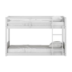 a white bunk bed sitting next to a pillow