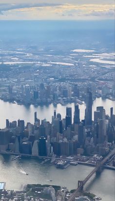 an aerial view of new york city and the brooklyn bridge