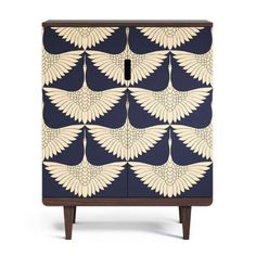 an art deco cabinet with blue and white designs