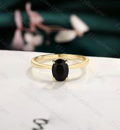 ✦ Handmade ✦ Material: SOLID 14K/18K white/rose/yellow GOLD ✦ Item#:2021622 ✦ Center stone: Black Onyx  ✦ Size: 6*8mm oval shaped Production We are jewelry artisans and manufacturers.  Every ring is made from the very scratch, and made by hand and carefully polished. Custom orders Custom orders are welcome! convo us and we can work out a price and design for your specialty order.  Ring size I can make my designs in any ring size. If the ring size is not in the list, contact us and we'll custom m Black Rings Stamped 14k As Gift, Black 14k Gold Solitaire Rings, Black Solitaire Ring In 14k Gold, Black Solitaire 14k Gold Rings, Black Sapphire Ring In 14k Gold As Gift, Black Stone Ring Women, Yellow Gold Stacking Rings, Engagement Ring Simple, Black Onyx Engagement Ring