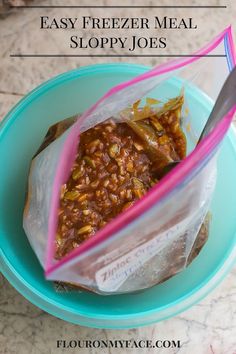 a plastic bag filled with food sitting on top of a blue plate