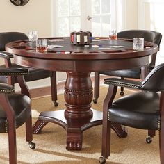 a dining room table with chairs around it