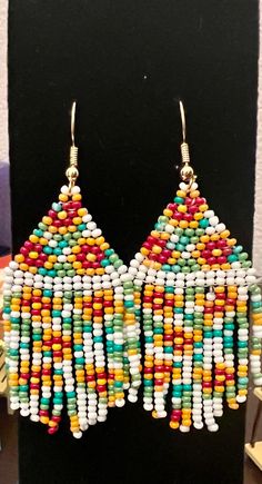 Traditional Fringe Beaded Drop Earrings, Traditional Fringed Beaded Earrings, Traditional Beaded Earrings With Fringe And Round Beads, Traditional Fringe Beaded Earrings With Round Beads, Traditional Beaded Fringe Dangle Earrings, Traditional Multicolor Beaded Tassel Earrings, Multicolor Fringe Beaded Drop Earrings, Multicolor Beaded Fringe Drop Earrings, Traditional Multicolor Beaded Fringe Tassel Earrings