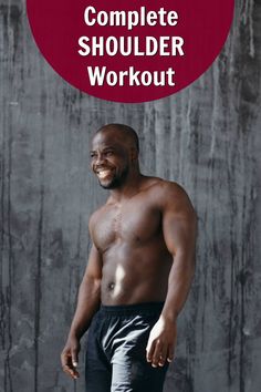 a man standing in front of a wall with the words, complete shoulder workout on it