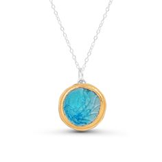 Float through the calm waters of this stunning sea-inspired gradient pendant. The gentle mix of coloured glass catches the light and is comfortable wear, making it a wonderful gift. Made from ceramic, glass, real gold detailing and sterling silver chain. Timeless and sophisticated handcrafted women's jewellery. Each piece has been carefully hand-shaped and painted, adding an elegant and contemporary feel. The kiln-fired glass gives the piece a high quality and gemstone-like appearance. The luxur Ocean-inspired Turquoise Round Pendant Necklace, Ocean-inspired Blue Round Pendant Jewelry, Ocean-inspired Blue Sea Glass Necklaces, Blue Round Recycled Glass Jewelry, Blue Recycled Glass Round Jewelry, Blue Recycled Glass Jewelry With Ocean-inspired Style, Blue Recycled Glass Jewelry, Ocean-inspired, Blue Recycled Glass Pendant Necklace, Blue Ocean-inspired Recycled Glass Jewelry