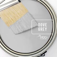 a close up of a paint brush on a mirror with the words dove grey above it