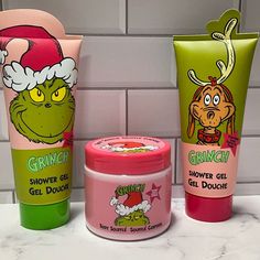 the grinch products are lined up next to each other in front of a tiled wall