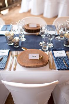 a table set up with place settings and silverware