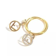 Item No.: E-240705-4 Name: Fendi F's Rhinestone Logo Double Ring Ring Shape: Ring Color: Gold Material: Metal Approx Size: Size Description: S #9(Jp Size) Listed Hand Measurements May Have A 1-2cm Difference. Gender: Women's Additional Items: Box , Item Rank: Used A Rank Condition Details: Outside:Minor Scratches,Light Stains Product Introduction: For The Point Of Coordination. Fendi Jewelry, Hand Measurements, Ring Shapes, Double Ring, Ring Color, Ring Metal, Product Introduction, Light Stain, Ring Ring