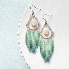 With the sand between your toes. You walk up to the waters edge where the light, frothy waves hit your ankles. Looking out over the sea, the water gets darker as it gets deeper. You're reminded how truly beautiful the world is. 🌊 These ocean themed beaded fringe earrings are the perfect summer accessory. also great for a beach wedding!  These make a fabulous gift for the boho beauty in your life! Ear wire is nickel free.  See photos for measurements.  Ready to ship! Please give me 1-3 business days to pack up your order.  Enjoy your new earrings! Beach Dangle Beads Jewelry, Beach Earrings With Dangling Beads, Beach Jewelry With Teardrop Dangling Beads, Teardrop Dangling Beads Jewelry For Beach, Summer Beach Jewelry With Beaded Fringe, Beach Teardrop Jewelry With Dangling Beads, Beaded Fringe Dangle Jewelry For Beach, Beach Dangle Jewelry With Beaded Fringe, Turquoise Earrings With Beaded Fringe For Beach