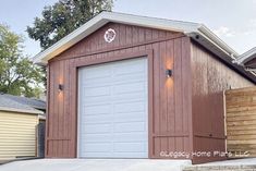 a red garage with white doors and windows