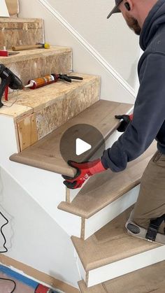 a man is working on some stairs with a drill and screwdriver in his hand