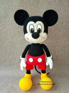 a crocheted mickey mouse is posed for a photo