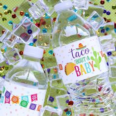 water bottles are shown with the words tacos for a baby on them and an image of