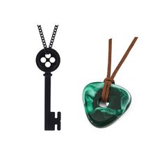 a black and green necklace next to a key on a white background with a brown cord