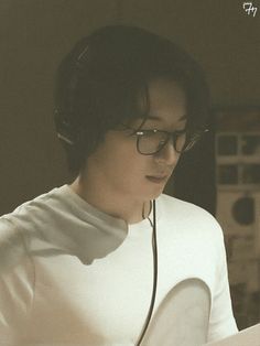 a person wearing headphones and listening to music