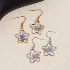 Five-pointed Star Earrings | Forget Me Not Flower Earrings | Resin Earrings | Handmade Real Pressed Flower Earrings | Christmas Gift for Her 🌸The Five-pointed Star Earrings, Forget Me Not Flower Earrings are a stunning and unique accessory that adds a touch of elegance to any outfit. Handmade with real pressed flowers encased in resin, these earrings showcase the beauty and delicacy of nature. The five-pointed star design adds a touch of whimsy and charm, while the forget-me-not flowers symbolize love and remembrance. These earrings are perfect for those who appreciate handmade craftsmanship and want to make a statement with their jewelry. Whether it's for a special occasion or daily wear, these earrings are sure to catch the eye and spark conversation.  H I G H L I G H T  - Handmade: Eac Pressed Flower Earrings, Forget Me Not Flower, Earrings Resin, Five Pointed Star, Earrings Christmas, Christmas Gift For Her, Five Points, Star Design, Resin Earrings