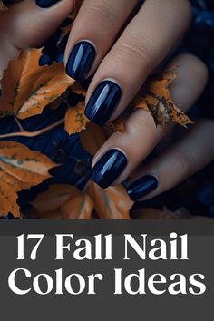 Hand with dark blue nail polish holding dried autumn leaves. Text: "17 Fall Nail Color Ideas". Fall Nail Acrylic Colors, Nails Fall Halloween, Fall Nails 2024 September, Nail For September, Nails September Colors, Plum Gel Nail Designs, Fall Lavender Nails, September Nail Color Ideas, Dip Nail Trends 2024