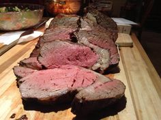 some meat is cut up on a cutting board