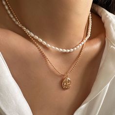 Elevate any ensemble with our Minimalist Pearl Choker, a 3mm pearl necklace crafted in 925 silver. This delicate piece exudes understated beauty, making it an ideal bridal necklace or bridesmaid gift. The mini pearls add a touch of sophistication to the minimalist design, creating a timeless accessory that seamlessly transitions from special occasions to everyday wear. Gift this enduring piece to her, a perfect blend of classic elegance and contemporary style. DETAILED DESCRIPTION// Material: Hi Pearl Layered Necklace With Pearl Charm For Gifts, Pearl Charm Layered Necklace Gift, Elegant Layered Necklace With Round Beads As Gift, Minimalist Pearl Pendant Jewelry With Round Beads, Gift Pearl Charm Layered Necklace, Pearl Drop Layered Necklace As Gift, Delicate Pearl Chain Choker As Gift, Delicate Pearl Chain Choker For Gift, White Layered Pearl Chain Necklace As Gift