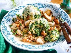 a white plate topped with broccoli and mushrooms