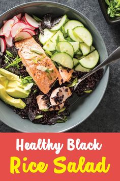 healthy black rice salad with salmon, cucumbers and radishes in a bowl