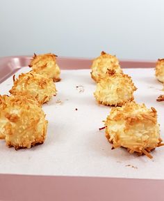 some food is laying out on a pink tray and it looks like they have been cooked