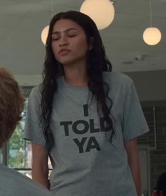 a woman in a t - shirt that says i told ya