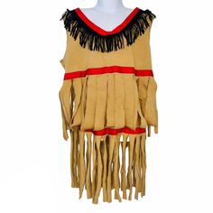 a mannequin dressed in native clothing with fringes on it's chest