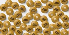 an array of yellow m & m's with the words happy birthday on them