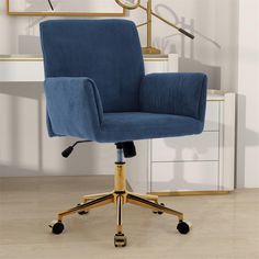 a blue office chair sitting on top of a wooden floor next to a white dresser