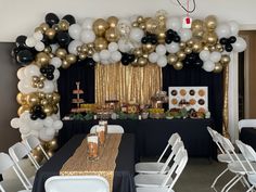 a party with balloons and decorations on the wall